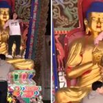 유명 관광지 불상 위에 올라가 ‘살아있는 보살’이라면서 춤춘 도른자 여성 (영상)